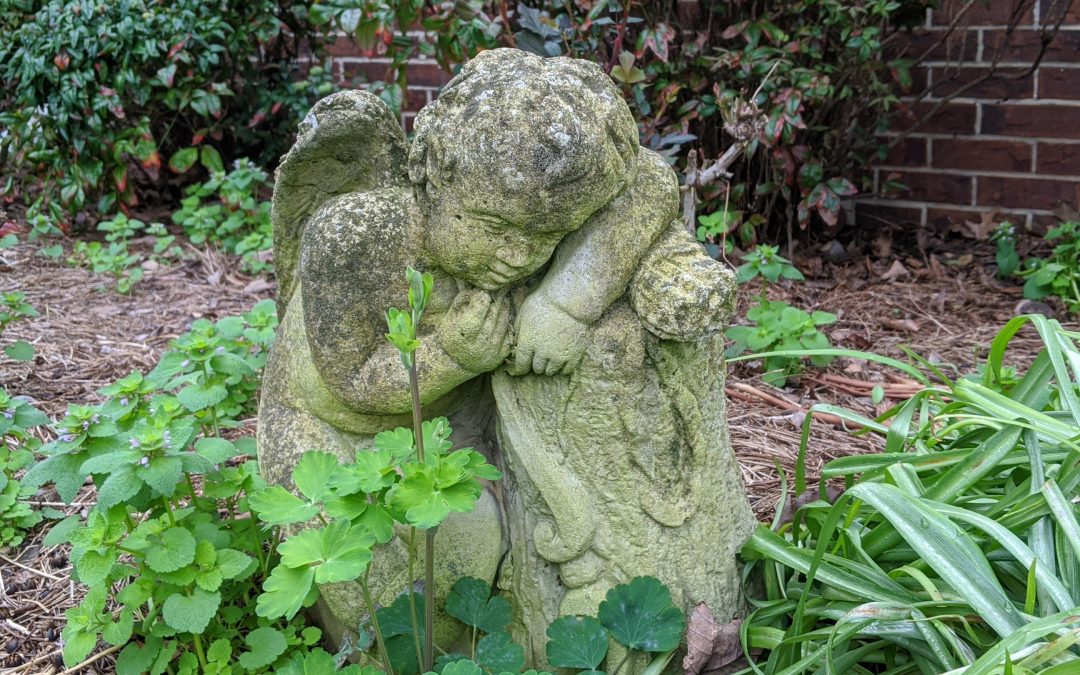 Cherub Statue in Garden